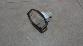Фонарь подсветки номера Honda Civic 4D FD