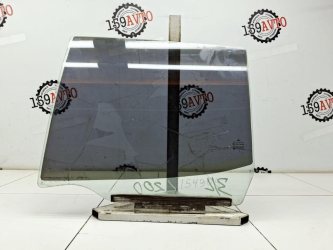 Стекло двери задней левой Mitsubishi L200 KA, KB